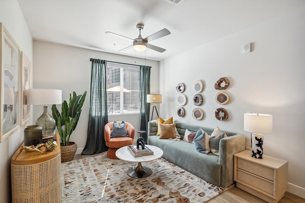 Living room with ceiling fan at The Braydon Apartments in Napa CA